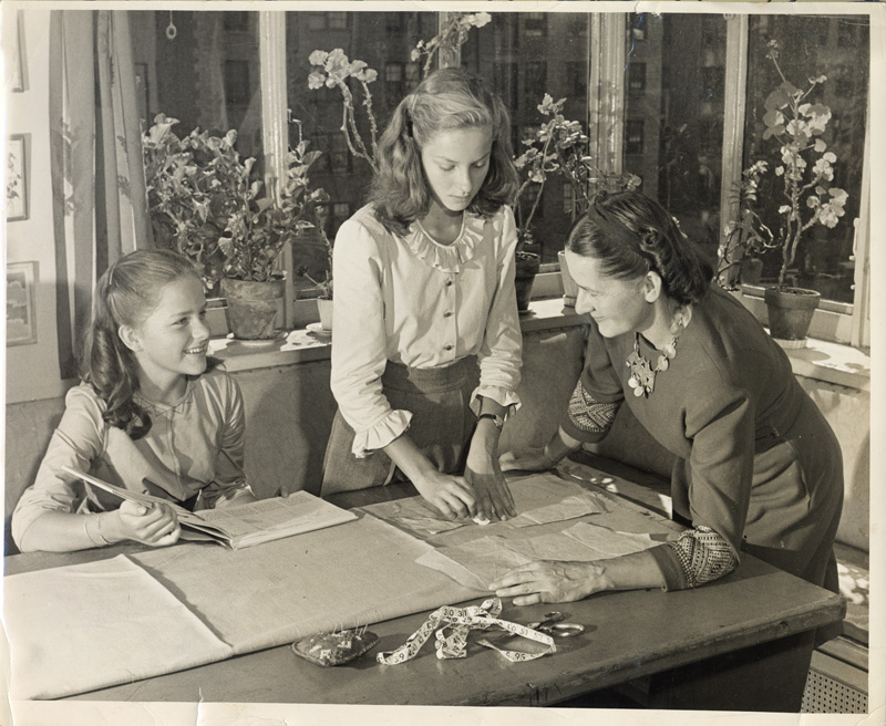 Conrad Eiger (New York, New York)
Mariska Karasz sewing with Solveig and Rosamond, ca. 1946
Photograph, 8 1/8 x 10 inches ©The Eiger family