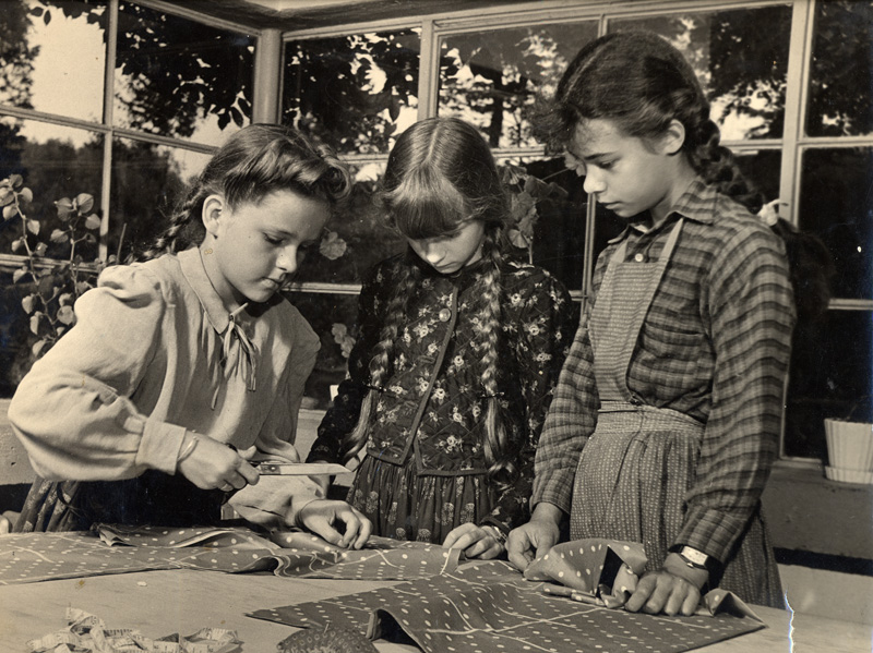Solveig, Rosamond, and Mariska’s niece Carola sewing, ca. 1943
Photograph mounted on board, 10 1/4 inches, board approx. 12 x 13 1/8 inches